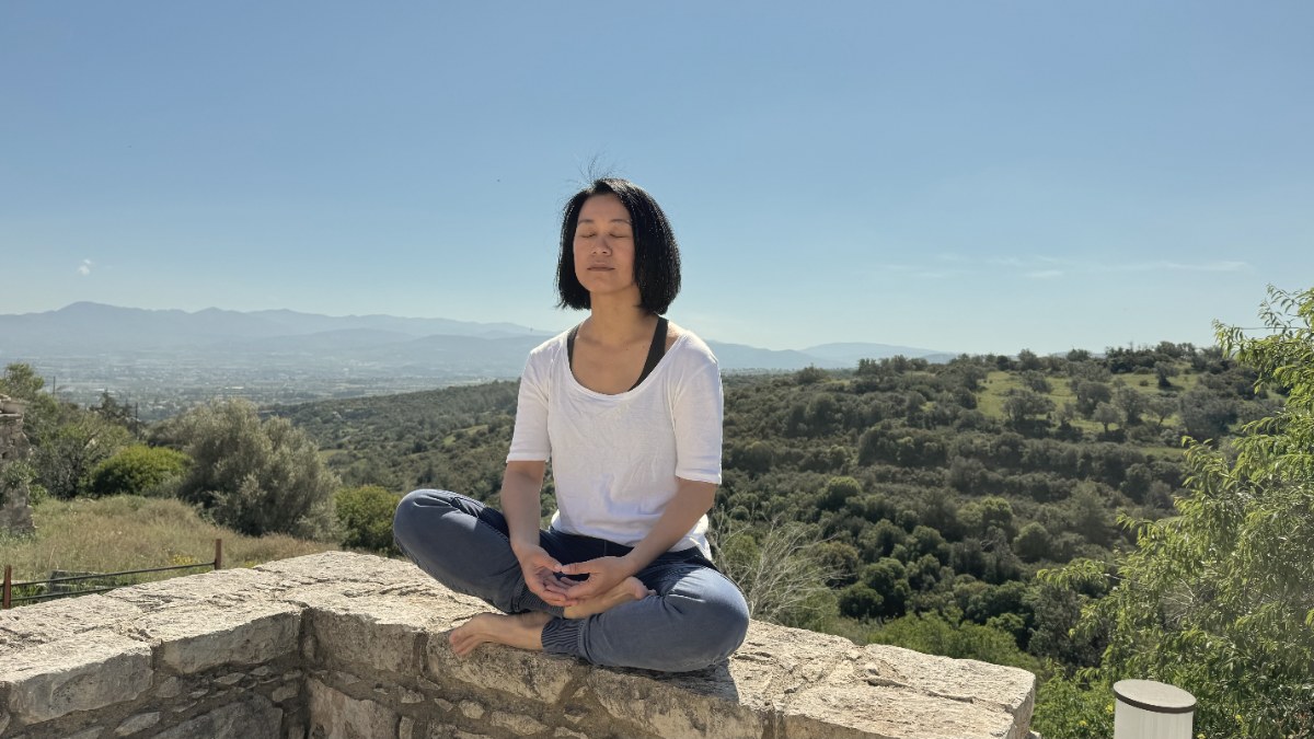 Aling Wu meditating outdoors